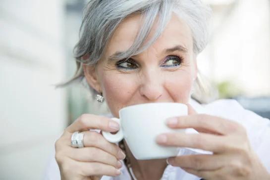 A middle-aged woman having a coffee