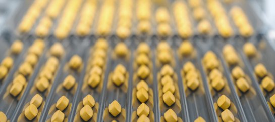 Burgerstein Sport tablets on a conveyor belt